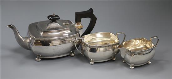 A George V silver three-piece tea service of rectangular form, gross 28.5 oz.